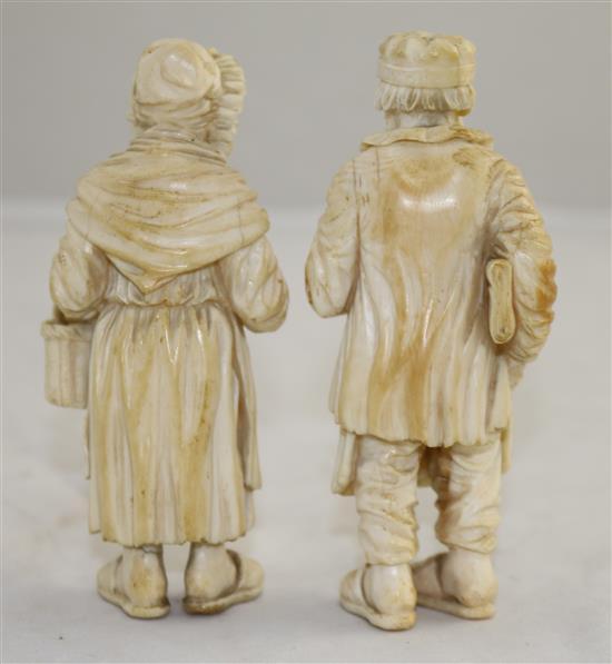 A pair of 19th century Dieppe ivory carvings of an elderly man and woman, 4.25in.